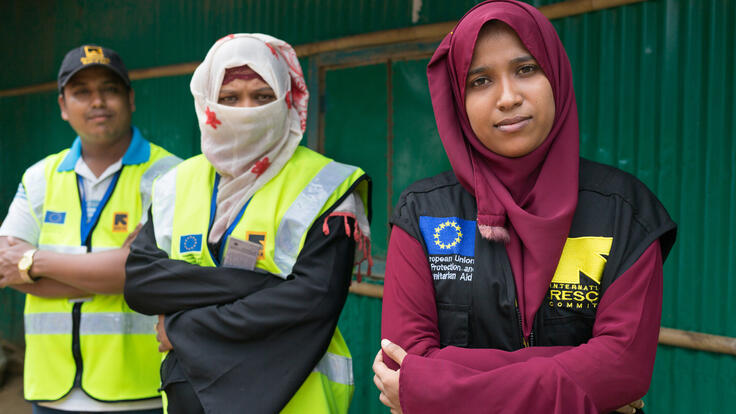 IRC health staff wearing branded vests, looking at camera