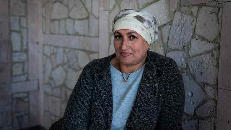 13 October 2022-Mykolaiv, Ukraine. Olga registers for a cash transfer program at a site on the outskirts of Mykolaiv.