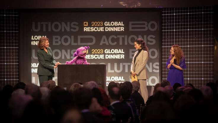 Group of women standing on a stage at the IRC Global Rescue Dinner