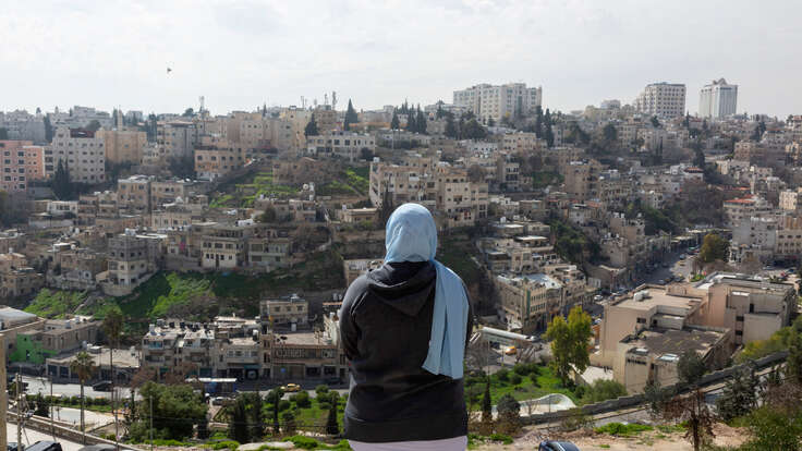 Hamida, 26, looks at the city of Aman.