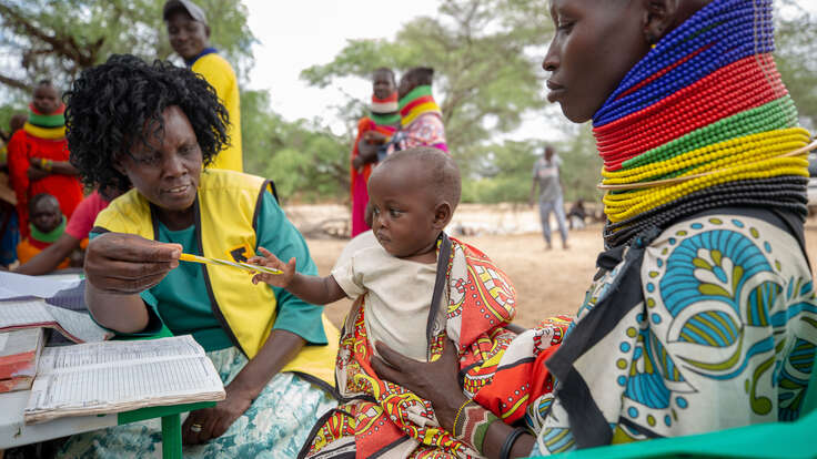 An IRC nurse attends to a child during an IRC community outreach program in Turkan, Kenya.